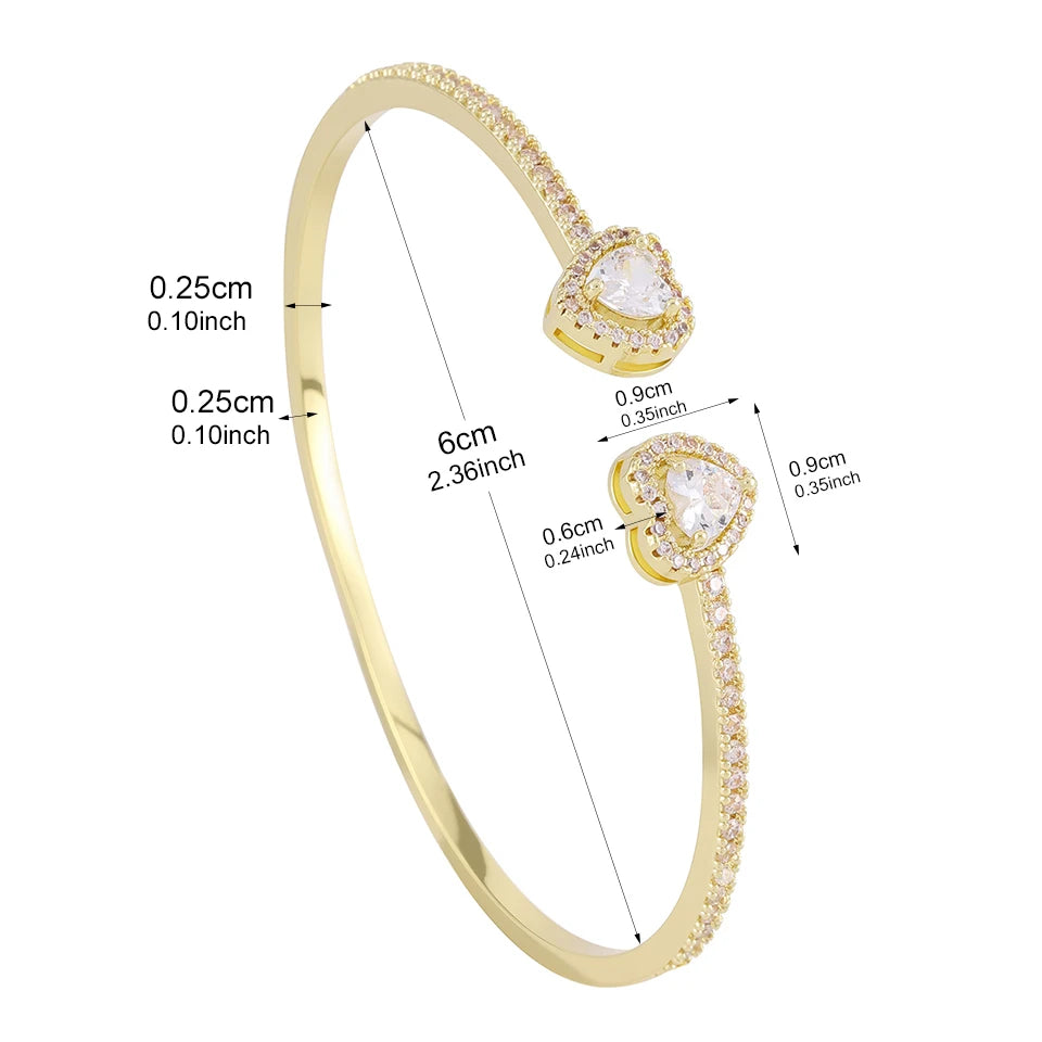 Gold-toned geometric rhinestone heart stacking bracelet set with adjustable chain and charms