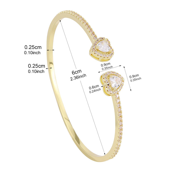 Gold-toned geometric rhinestone heart stacking bracelet set with adjustable chain and charms