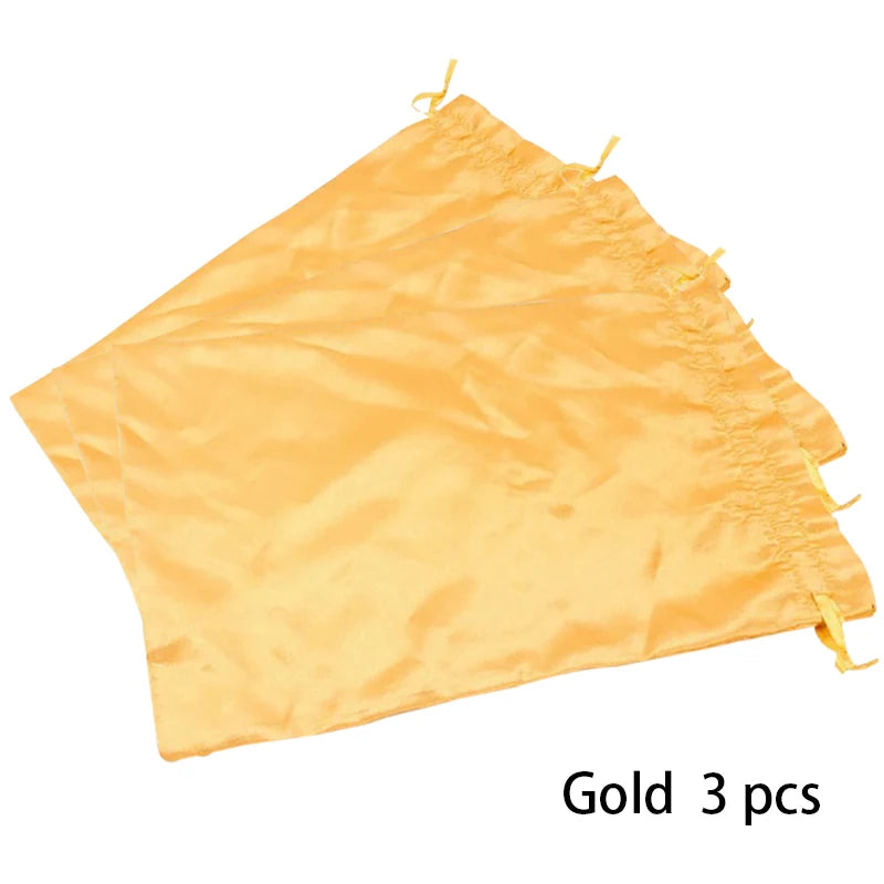 Drei goldene Satin-Aufbewahrungstaschen für Perücken