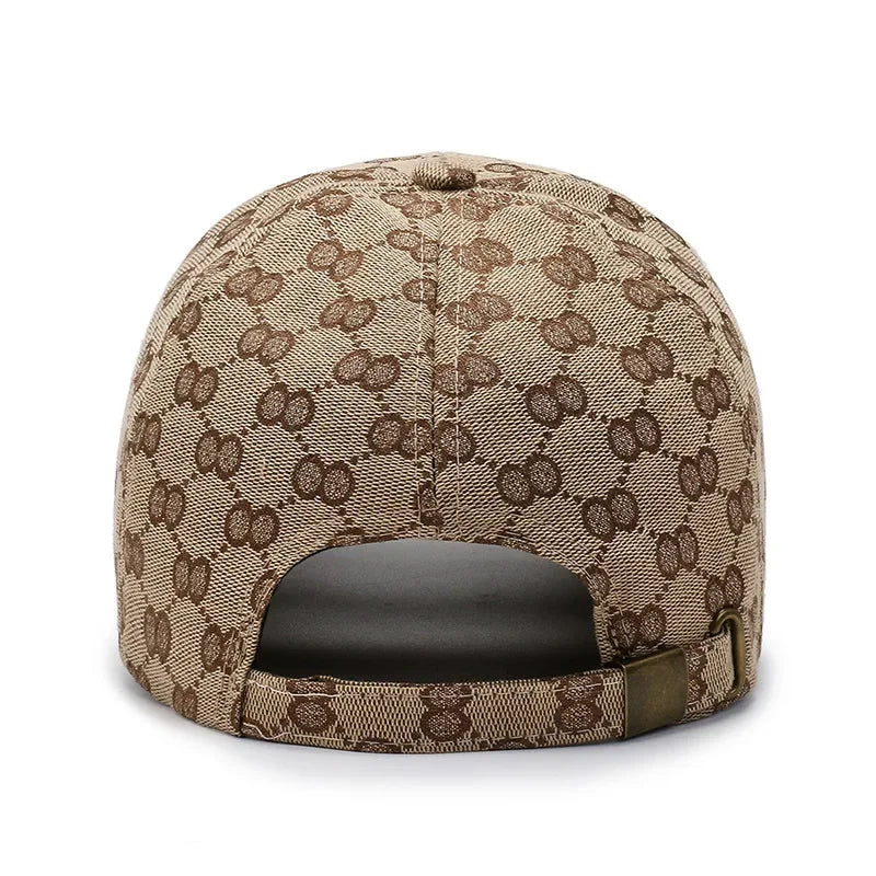 A beige cotton dot pattern baseball cap with a curved brim and mesh back.