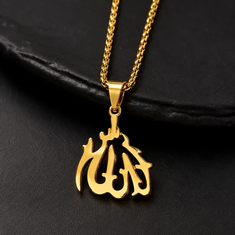 A gold-colored pendant necklace featuring the Arabic calligraphy of Ayatul Kursi on a black background.