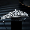 A sparkling cubic zirconia bridal tiara headband displayed on a dark surface.