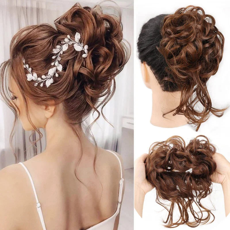A woman's hair styled in a messy bun with white floral accents, shown from the back and side.
