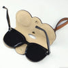 A tan leather pouch designed to store and protect sunglasses or eyewear.