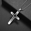 Silver retro Christian cross amulet necklace hanging on a dark surface