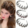A close-up of a woman wearing a sparkling rhinestone butterfly hair accessory in her brown hair.