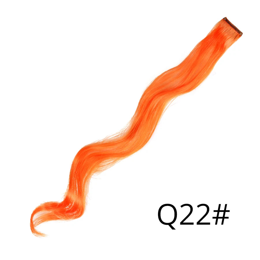 A vibrant orange synthetic hair extension is shown stretched out against a white background.