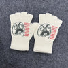 A pair of white fingerless knit gloves featuring a retro printed face design on the palm area.