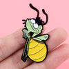 A cute firefly enamel pin brooch shaped like a frog with green skin and yellow wings