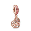 Rose gold cherry blossom charm pendant featuring a round bead and an ornate tree design.