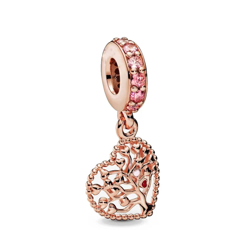 Rose gold cherry blossom charm pendant featuring a round bead and an ornate tree design.