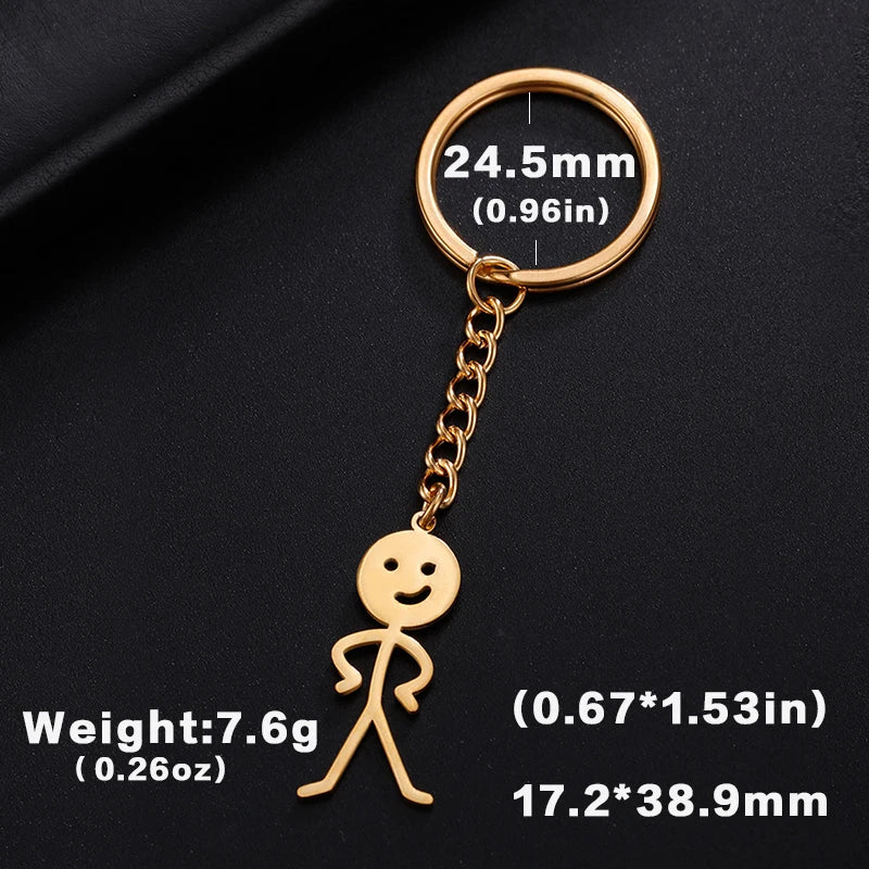 Gold-colored stickman keychain with a circular ring and dimensions listed.