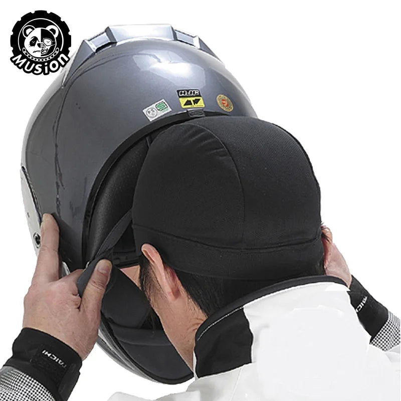 A black moisture-wicking cycling beanie cap is shown being worn by a person.