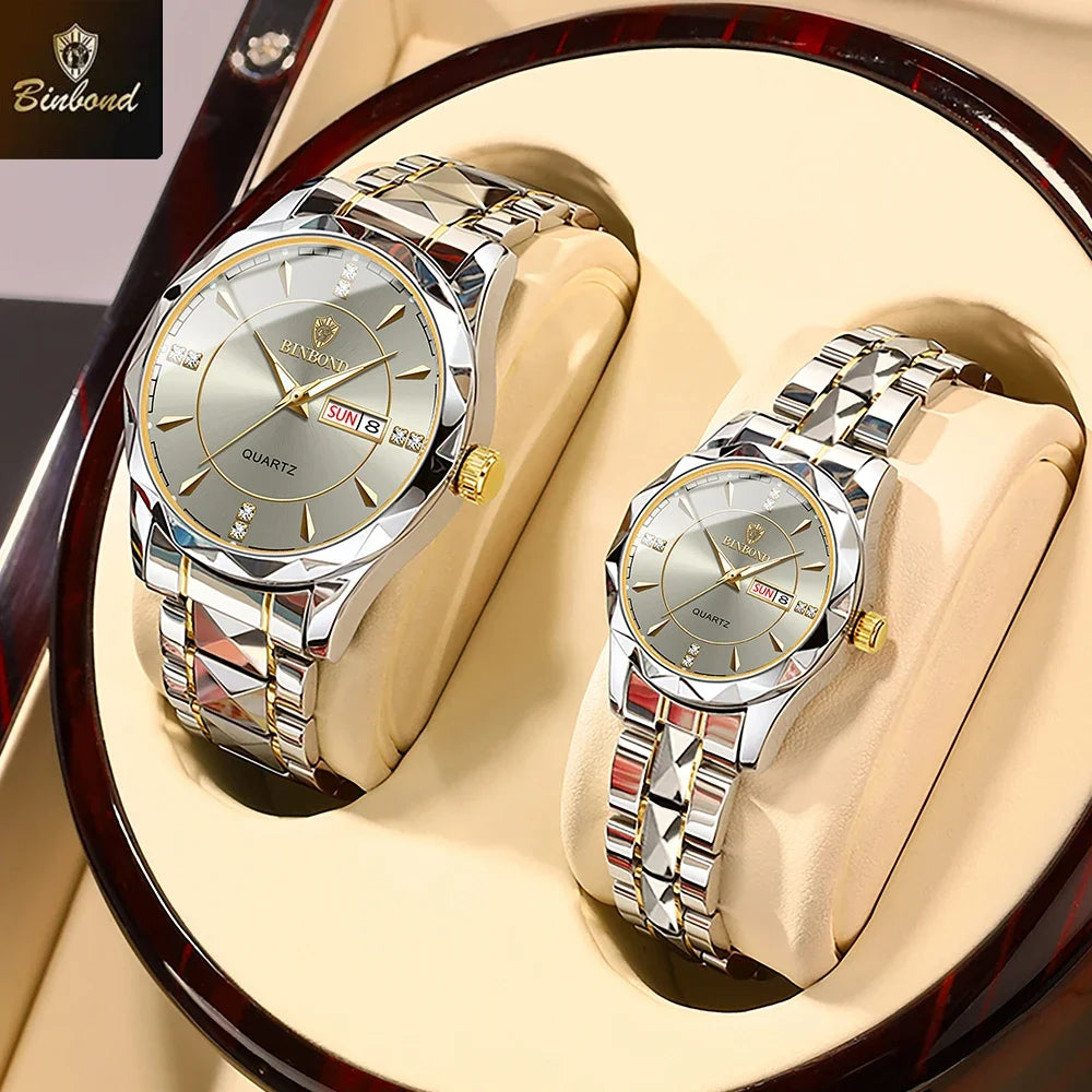 A pair of stainless steel quartz watches displayed in a velvet-lined box.