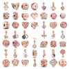 A collection of rose gold charm pendants featuring cherry blossom designs and various floral shapes.