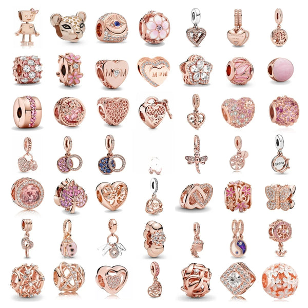 A collection of rose gold charm pendants featuring cherry blossom designs and various floral shapes.