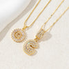 Gold-toned necklace set featuring CZ crystal pendants shaped like the letters A and Z.