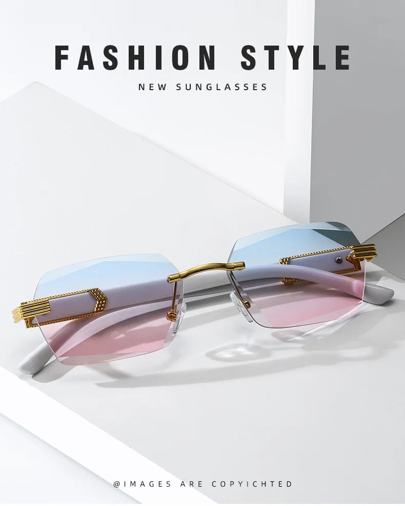 A pair of gradient sunglasses with pink and blue lenses and gold accents displayed on a white surface.