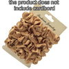 A pile of satin hair scrunchies in a golden beige color displayed on a cardboard backing.