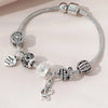 Silver beaded bracelet set featuring skulls and a heart charm