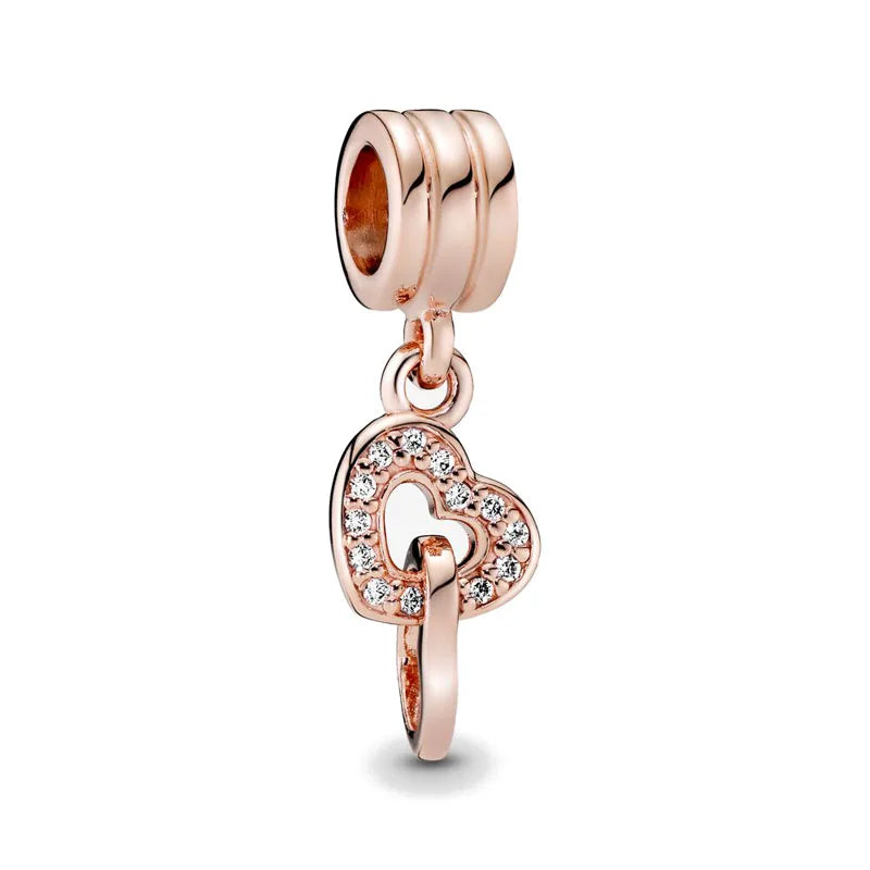 Rose gold cherry blossom charm pendant with a heart shape and a barrel link chain.