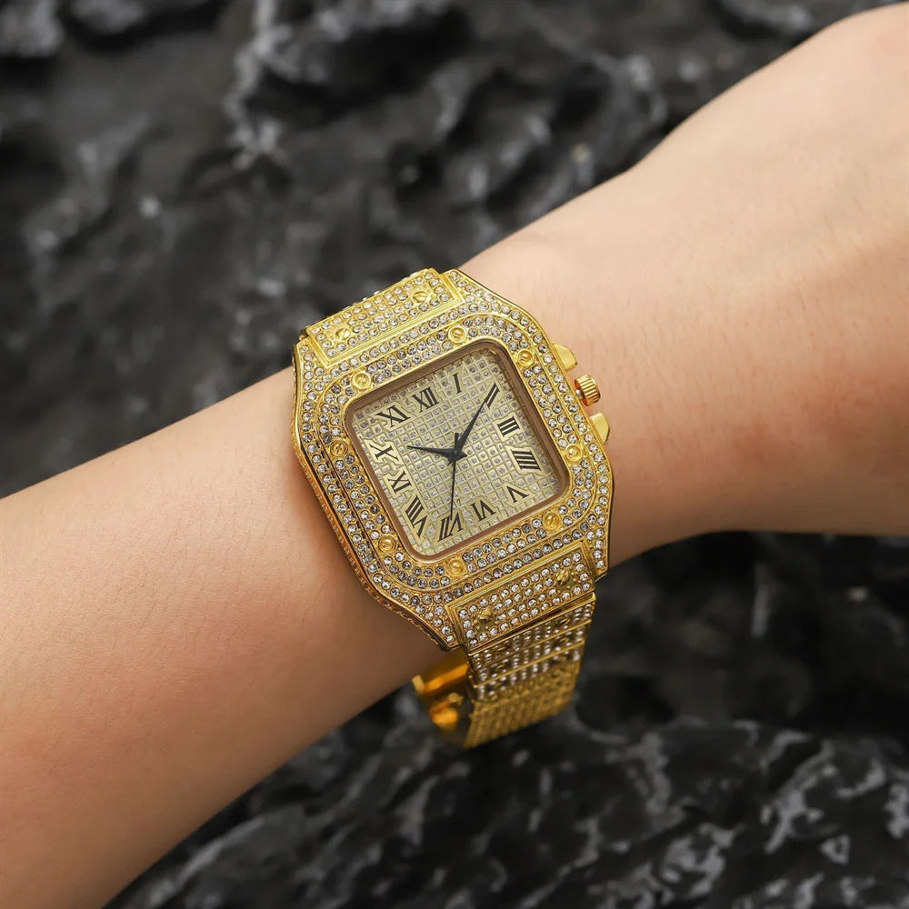 A gold-toned diamond crystal quartz wristwatch worn on a person's wrist.