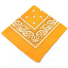 Orange fabric bandana featuring white paisley and geometric patterns for a headband or wrist wrap set