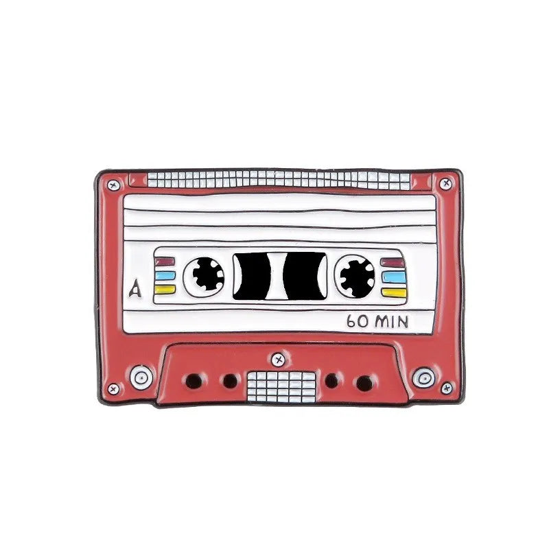 A retro fine line cassette enamel pin brooch with a red body and black accents.