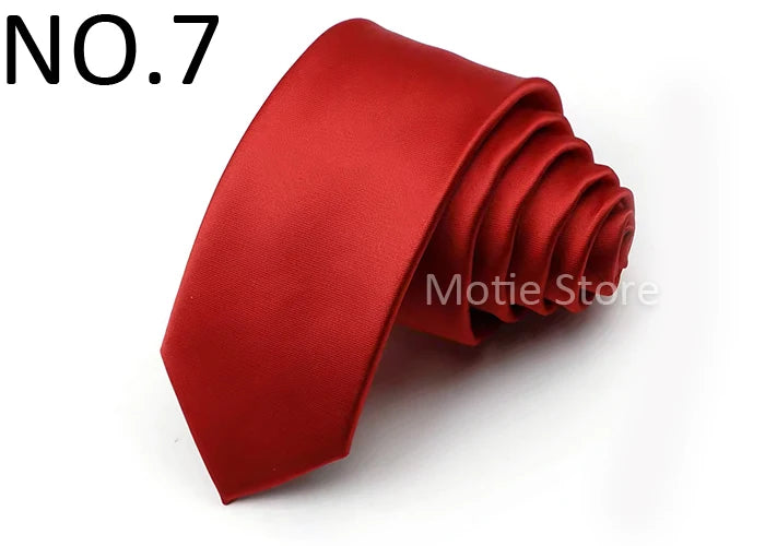 A folded red satin neck tie shown against a white background.