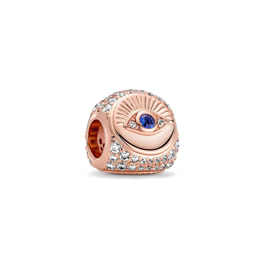 Rose gold charm pendant featuring a sunburst design and a blue gemstone surrounded by clear diamonds