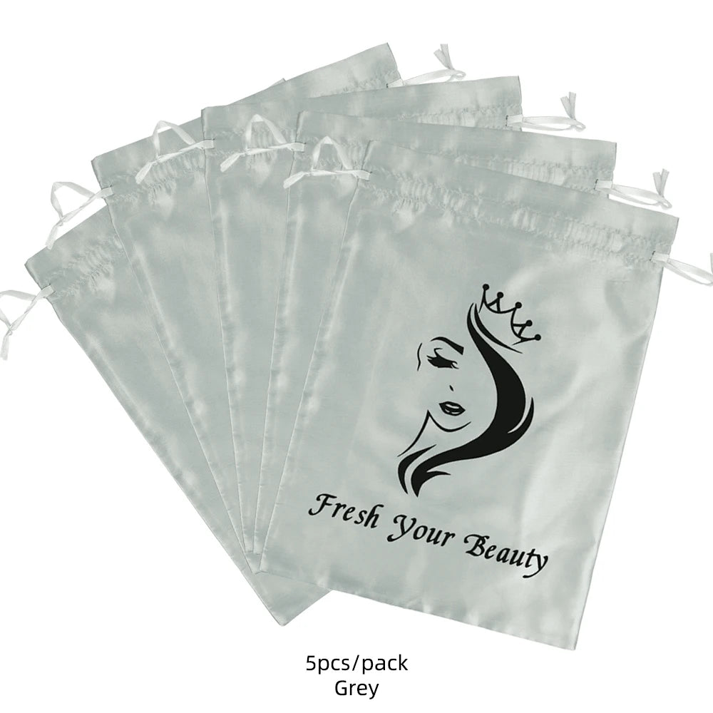 Five grey satin drawstring bags for storing wig and hair extensions