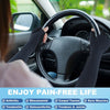 Black compression gloves being worn on a steering wheel, suggesting pain relief for arthritis and tendon issues.