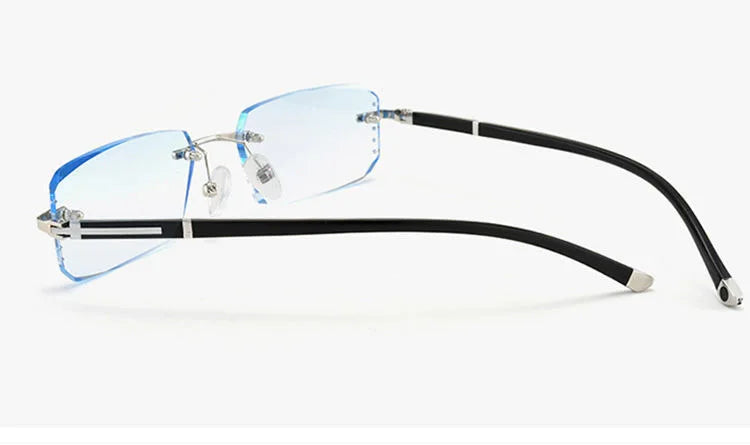 Frameless diamond cut reading glasses with black arms and clear lenses
