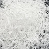 A pile of white disposable hair scrunchies for ponytail holders.