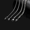 Three strands of stainless steel twisted chain bracelets laid diagonally on a black surface.