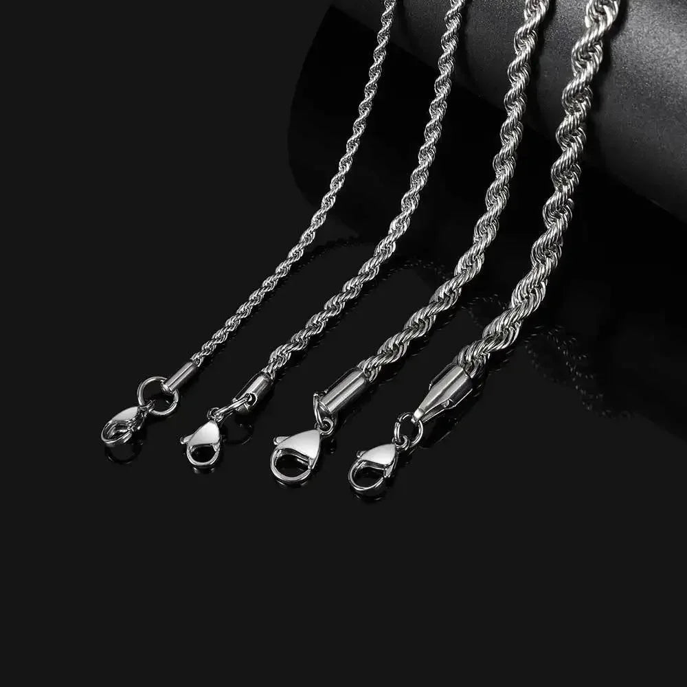 Three strands of stainless steel twisted chain bracelets laid diagonally on a black surface.