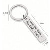 Silver keychain with a circular ring and a rectangular tag engraved with the message I Love You The End I Win