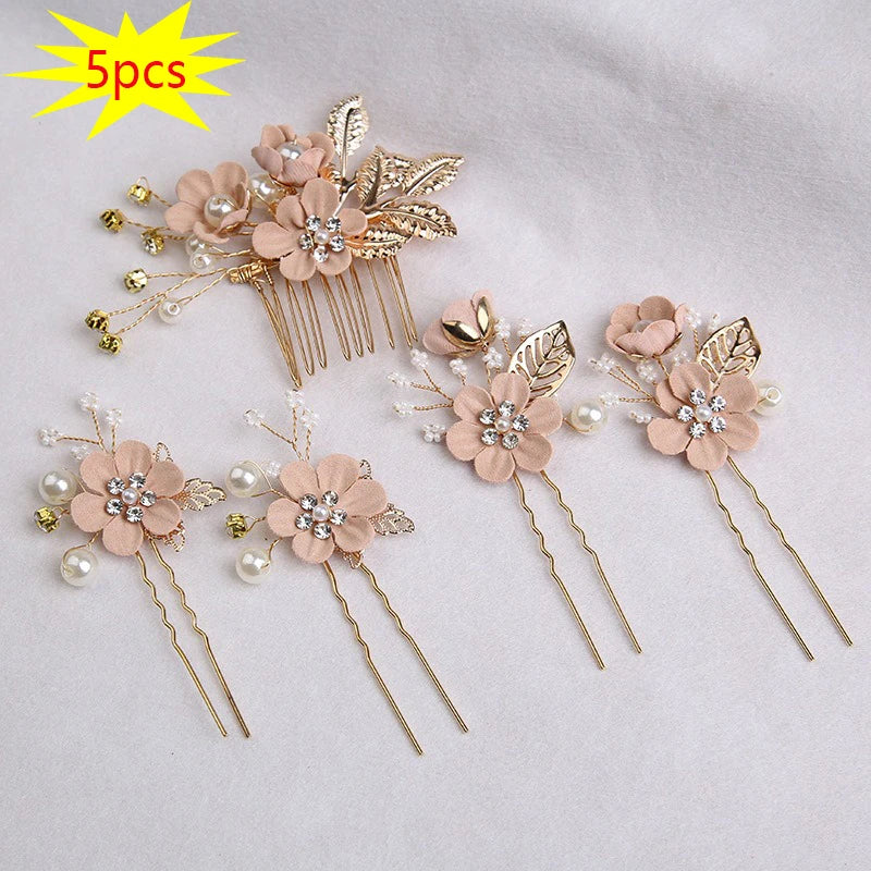 A set of five floral pearl bridal hair accessories featuring light pink flowers and gold accents.