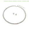 A delicate silver necklace and matching earrings set featuring clear crystals.