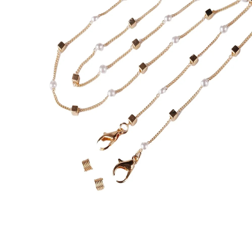 Gold chain with pearl beads and a charm lanyard for eyeglasses
