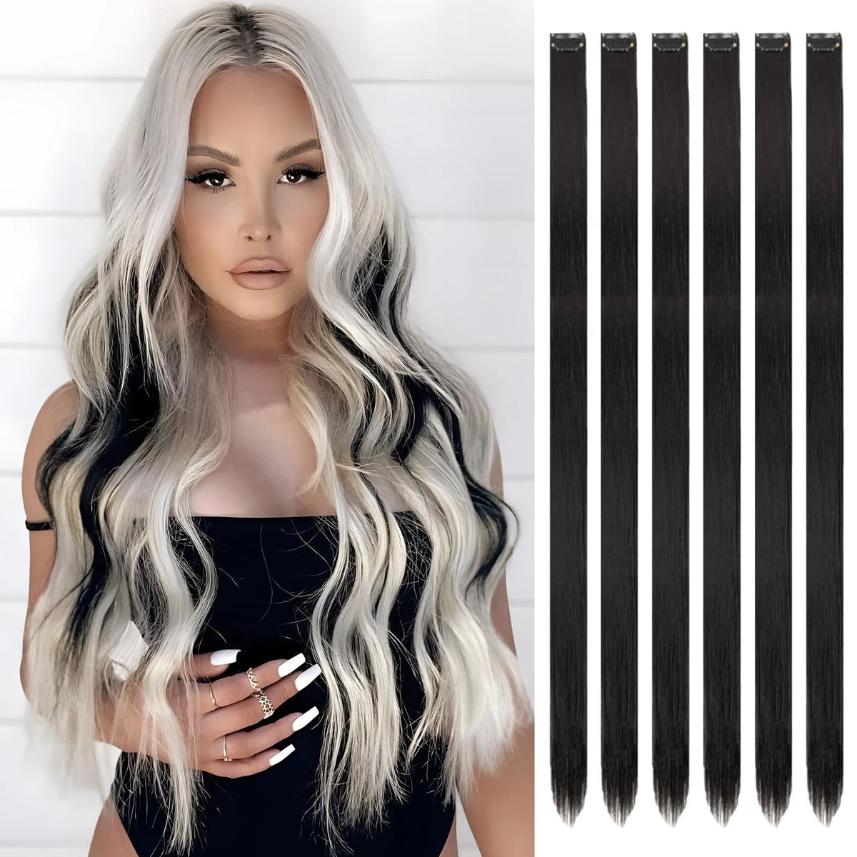 A woman models long, wavy, silver and black hair extensions against a white background.