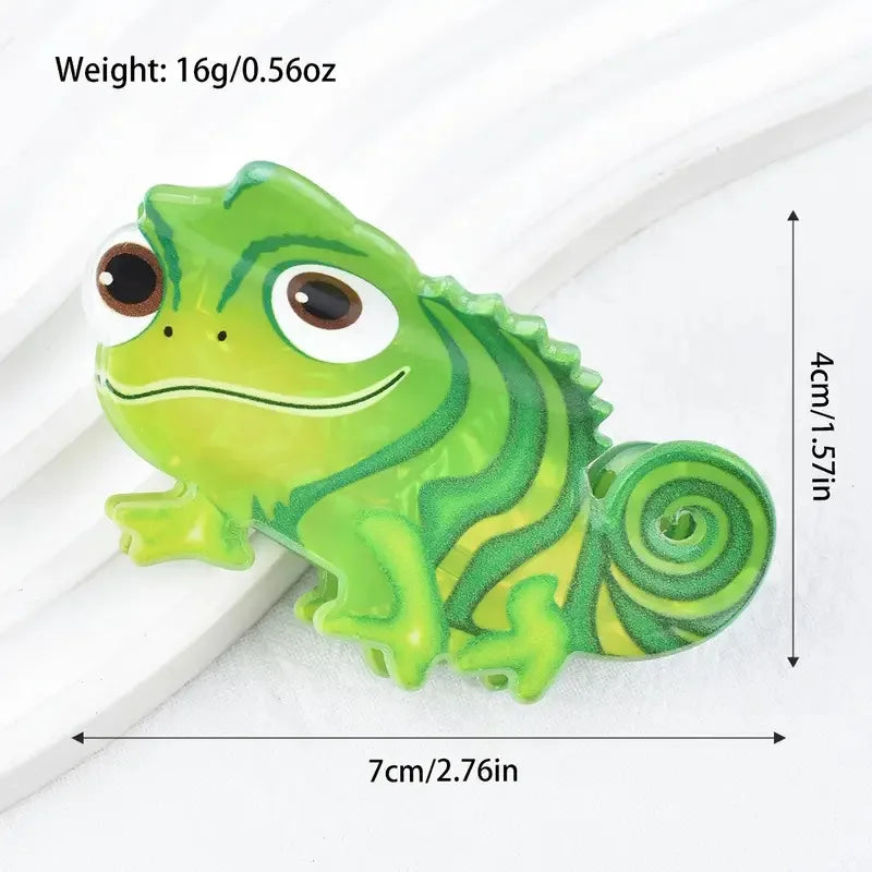 A bright green plastic lizard charm with a spiral tail is shown on a white background.