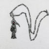 Silberner Anhänger mit Santa Muerte, Krone und Schädel.