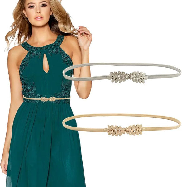 A woman models a teal dress with a gold chain waist belt and a matching gold leather belt.