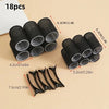 A set of 18 self-gripping hair rollers in black and dark gray shades are displayed on a light background.