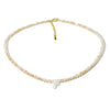 A delicate necklace made of mother of pearl beads with crystal accents and a silver initial charm.