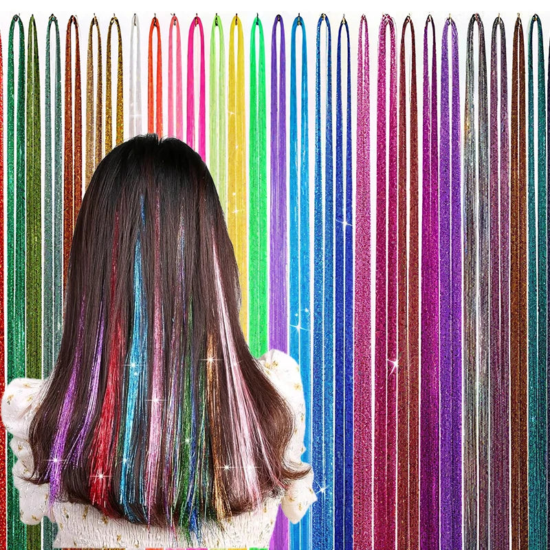 A woman's dark hair is styled with long, colorful glitter hair extensions in various shades and textures.
