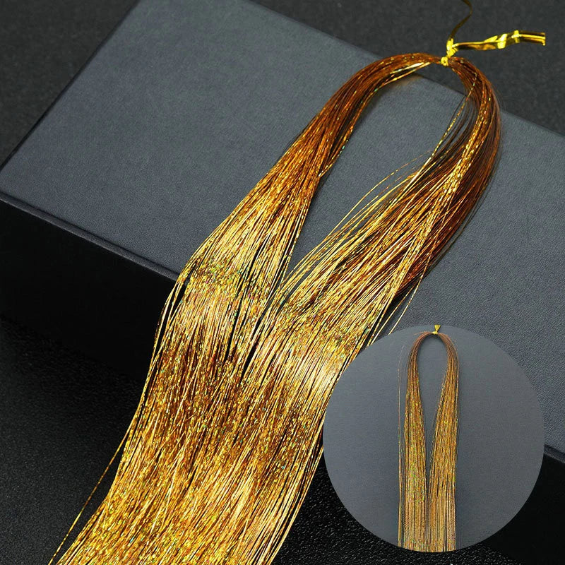 Golden hair extensions strands laid out on a dark surface with a circular inset showing the texture.