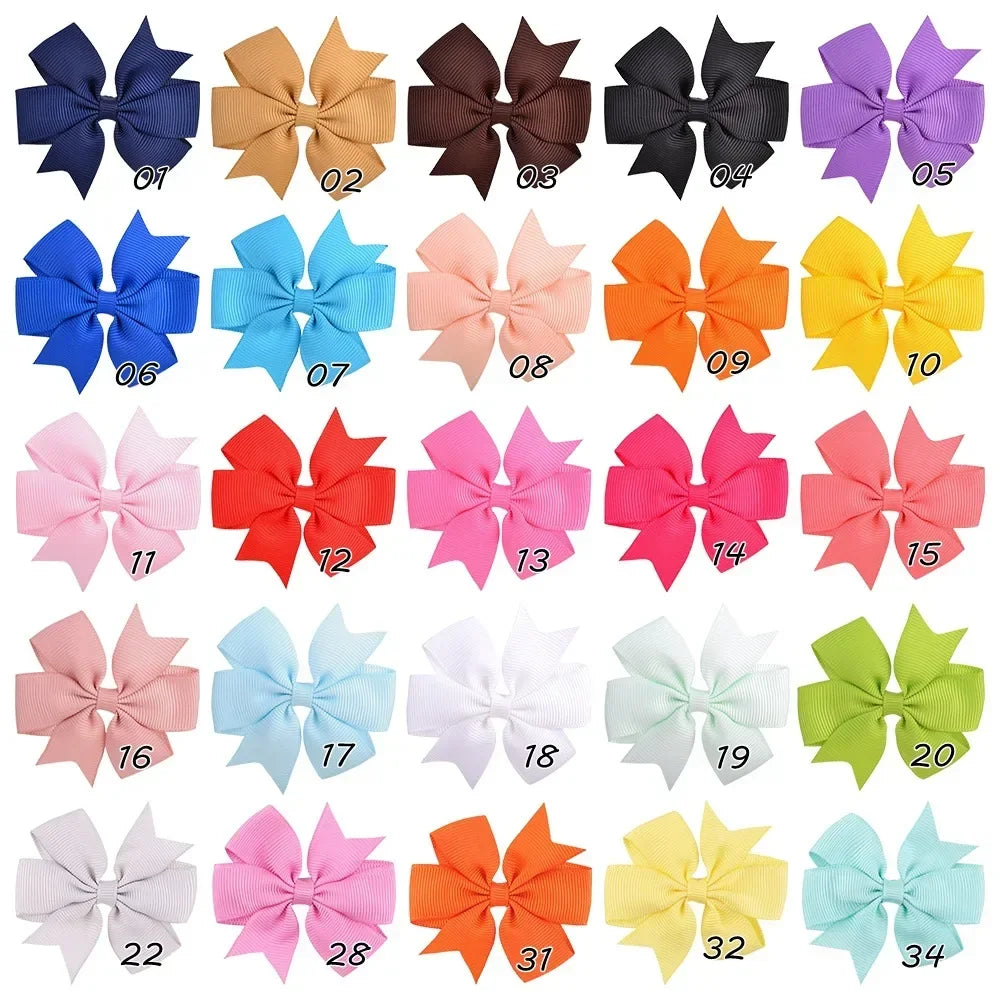 Assorted grosgrain ribbon hair bow clips in various colors and patterns for girls