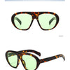 Front view of demi green tortoise shell sunglasses with a gradient lens and 45 degree angle.